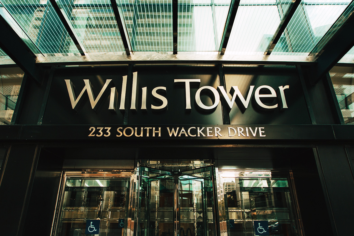 Willis Tower entrance sign above the doors at 233 South Wacker Drive
