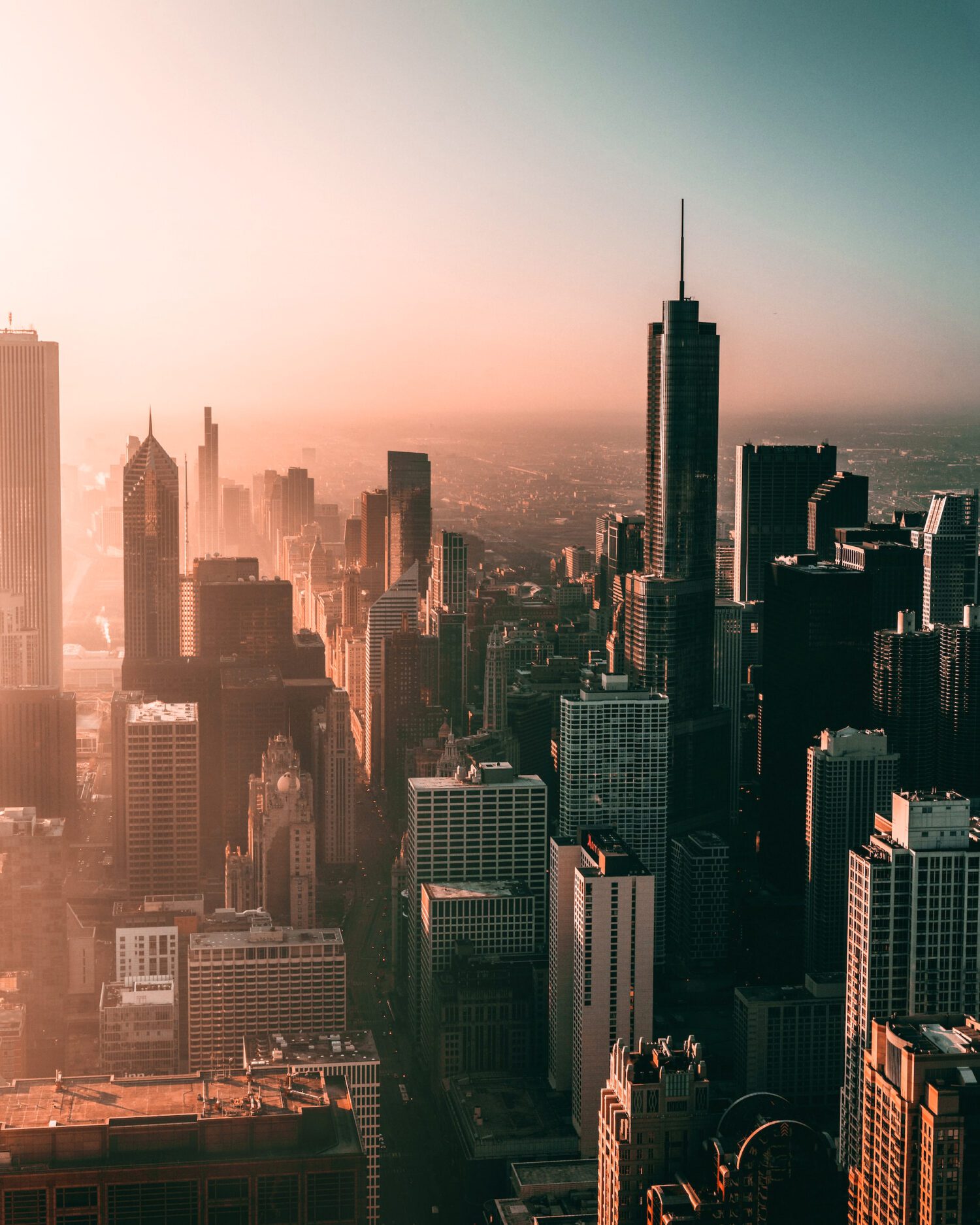 Willis Tower centred within Chicago’s skyline in warm evening light