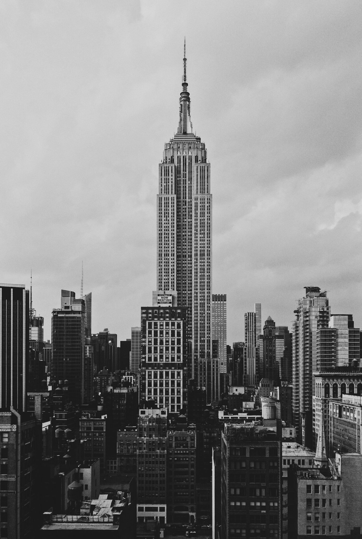 Black-and-white view of the Empire State Building above the Manhattan skyline