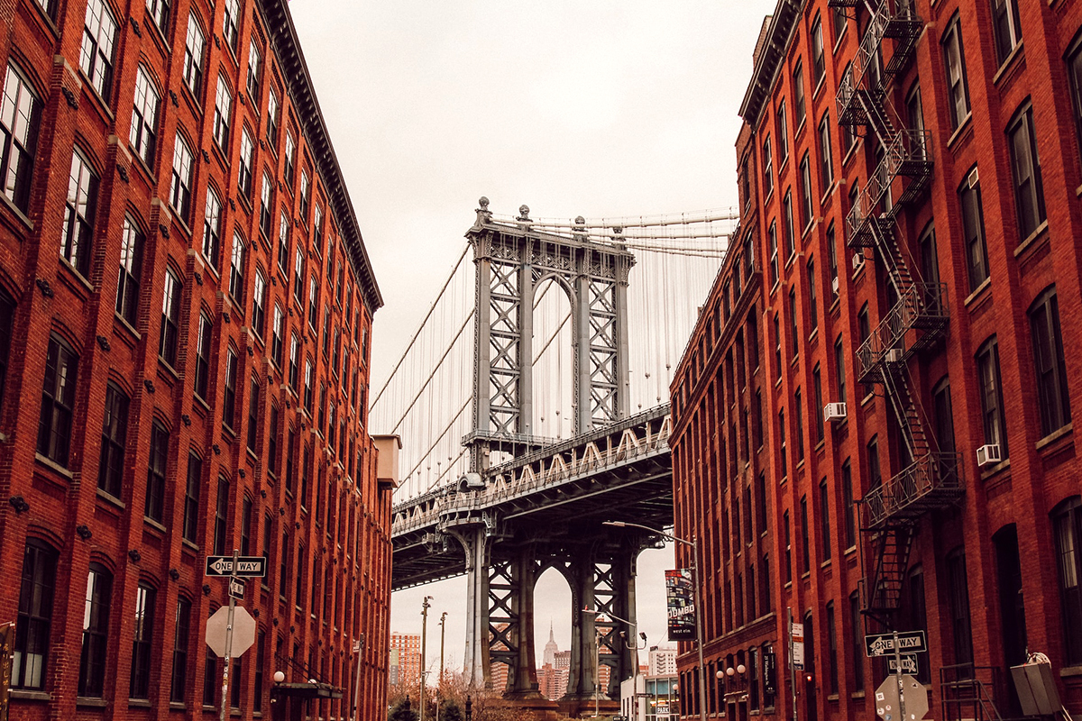 The classic DUMBO view with the bridge framed between buildings