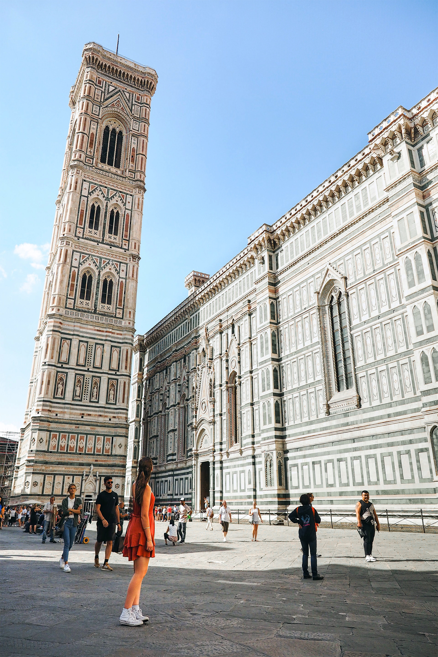 The side of the cathedral and Giotto's Bell Tower rising above Piazza del Duomo