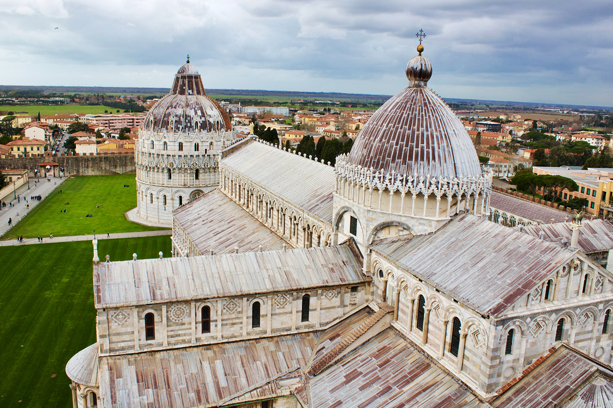 Pisa Cathedral, Baptistery and Tuscan rooftops seen from above