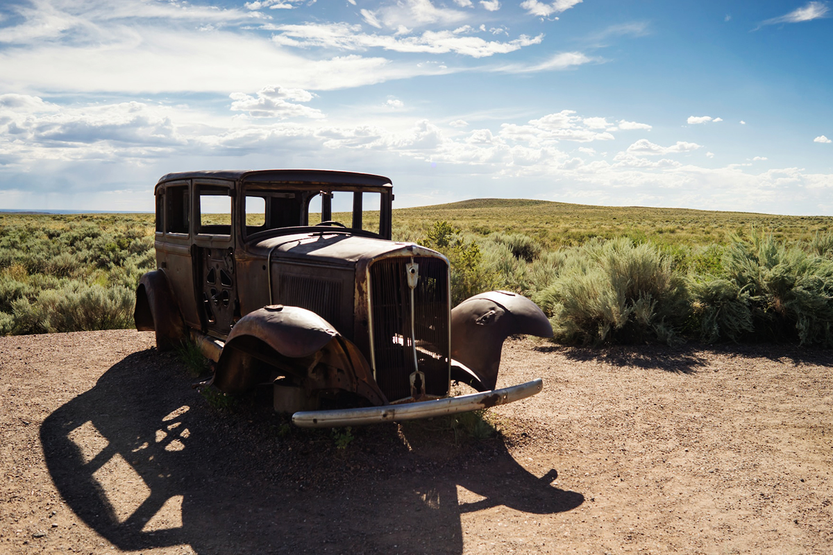 Rusting historic automobile marking the former Route 66 alignment in Petrified Forest National Park